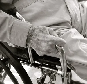 Portrait of a chiropractor with his patient sitting in the background